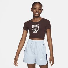 Keep it comfy in this cropped, fitted tee. Soft cotton fabric has a slight stretch so you can run, jump and play without holding back. Fitted Tee, Nike Kids, Workout Tee, Nike Sportswear, Big Kids, Cotton Spandex, Graphic T Shirt, Graphic Tshirt, Cotton Fabric