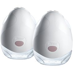 two white egg shaped bottles sitting next to each other