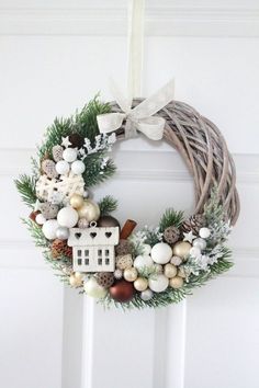 a christmas wreath hanging on the front door