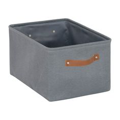 a gray storage box with leather handles on the bottom and inside, in front of a white background