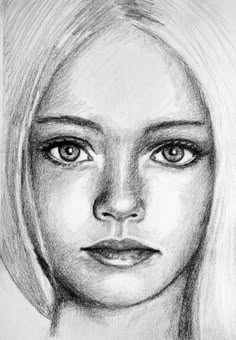 a pencil drawing of a woman's face with long blonde hair and blue eyes