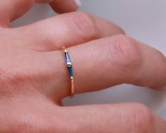 "Natural sapphire tapered baguettes ring made from 14K gold.   A minimalist ring set with to custom cut tapered baguette sapphires. perfect for stacking or worn alone. Available also in other gold colors such as white gold or rose gold and also in 18K gold - please see all options and quoting in the drop down menu above. Ring description: * Dimensions: 0.08\" / 2 mm top width down to a 0.07\" / 1.7 mm band. * Material: 14K yellow gold Stone:  * two natural tapered baguette cut sapphires. Total c Baguette, Baguette Ring Band, Gem Tones, Baguette Ring, September Birthstone, Minimalist Rings, Lovely Jewellery, Natural Sapphire, Stacking Ring