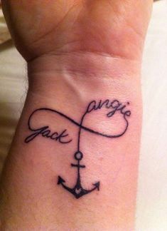 a wrist tattoo with an anchor and the words paris