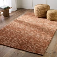 an orange rug in a living room