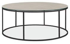 a round glass table with metal frame around the top and bottom, viewed from the side