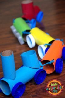 some very cute little toy cars made out of toilet paper rolls and pipe cleaners