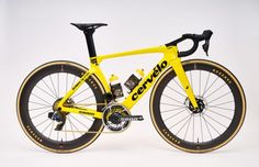 a yellow and black bike is shown against a white background with the words cervelo on it