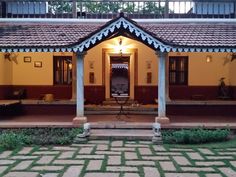 the front entrance to a house with an open porch