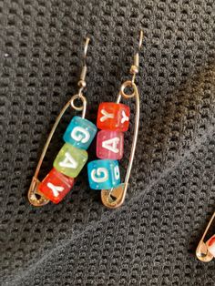 Show your pride with these cute bead safety pin earrings! Handmade Clay Jewelry, Pin Earrings, Safety Pin Earrings, Bead Earrings, Safety Pin, Clay Jewelry, Beaded Earrings, Diy Jewelry, Jewelry Earrings Dangle