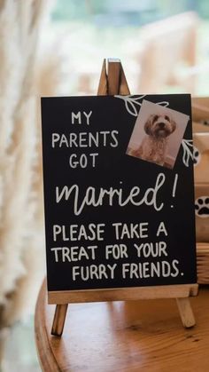 a sign that says, my parents got married please take a treat for your furry friends