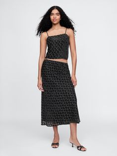 Soft burnout velvet midi skirt.  Elasticized waist.  Fit: Slim.  An A-line silhouette that's slim through the waist & hip with a flared opening.  Hits below the knee.  Models wearing Gap Velvet Midi Skirt, Midi Skirt Black, Burnout Velvet, Cute Prom Dresses, Black Midi Skirt, Skirt Black, Toddler Gifts, Black Floral, The Knee