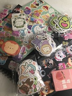 many different animal stickers are on the table