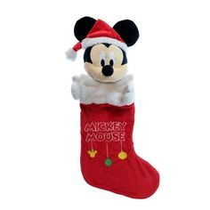 a mickey mouse christmas stocking hanging on a wall with the words merry mouse written on it