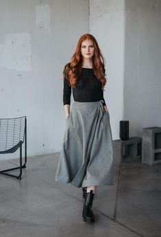 Embrace timeless elegance with our wrap wool skirt, designed for both style and functionality. This skirt features a classic wrap design with a tie waist, allowing for an adjustable fit that flatters your figure. Crafted from high-quality wool, it provides warmth and a sophisticated, structured look, making it ideal for cooler weather. Designed with convenient side pockets, this skirt combines practicality with style, making it perfect for both casual outings and more formal occasions. Its versa