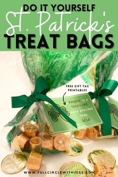 a bag filled with lots of treats next to some gold coins and green ribbon tied around it