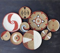 several woven baskets with different designs on them