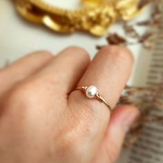 ✨ Tiny Freshwater Pearl Ring with choices of 14K Gold Filled, Rose Gold Filled or 925 Sterling Silver, June Birthstone Gift • Pearl Size: 4 mm• Ring Band: 0.8 mm • Handmade in your ring size with natural gemstone beads. • Dainty & cute. The ring is slim and petite, yet durable to wear daily. • Gold-filled is known for its lasting quality. The ring will not tarnish or turn color. You can wear them every day or even in a shower.• Hypoallergenic. You won’t have to worry about allergies from metal s Dainty Handmade Jewelry, Simple Pearl Ring, Diy Pearl Rings, Selfmade Jewelry, Forklift Certified, Pearl Ring Simple, Pearls Ring, Handmade Pearl Jewelry, Natural Pearl Ring