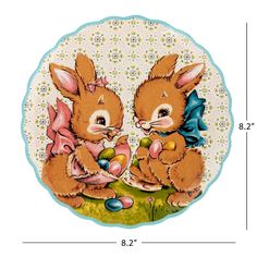 a plate with two rabbits on it and an easter egg in the other one's hand