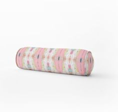 a roll of pink and white fabric on a white background