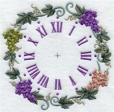 an embroidered clock with grapes and vines around the face is shown in purple, green, yellow and pink colors