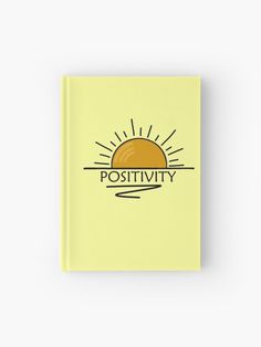 a yellow book with the words positivity on it and an orange sun in the background