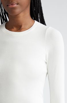 Minuscule ribs make this supersoft and stretchy modal top an instant favorite whether layered or worn alone. 21" length (size medium) Crewneck Long sleeves 97% modal, 3% elastane Hand wash, dry flat Imported Fitted White Tops With Ribbing, White Fitted Tops With Ribbing, White Fitted Top With Ribbing, Seamless Second-skin Crew Neck Top, Versatile Second-skin Tops For Spring, Sleek Stretch Tops For Loungewear, Sleek Fitted Tops For Everyday, Fitted Long Sleeve Modal Top, Fitted Modal Long Sleeve Tops