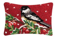 a decorative pillow with a bird on it