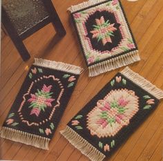 three small rugs on the floor with tassels and fringe trimming around them