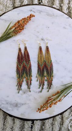 Change of Seasons 🍂 For those wild at heart, made with love.  Beautiful handmade red and yellow beaded earrings with Chinese crystal accents throughout. Please be sure to choose either red or yellow from the drop down menu.  Made with high quality delica seed beads and fire polished beads. Gold plated stainless steel hooks. Beaded Sunflower Earrings, Bugle Bead Earrings, Fall Accents, Beaded Fringe Earrings, Native American Beaded Earrings, Earrings Big, Sunflower Earrings, Seed Bead Patterns, Beaded Jewelry Tutorials