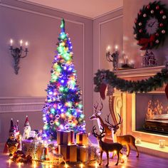 a christmas tree decorated with multicolored lights and presents in front of a fireplace