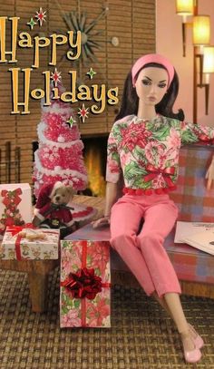 a doll is sitting on a couch with presents in front of her and the caption reads happy holidays