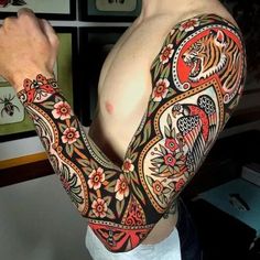 a man with a tattoo on his arm