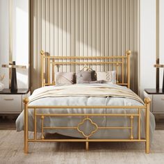 a bed with gold frame and pillows in a bedroom