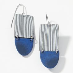 two pairs of blue and white striped earrings with silver hooks hanging from the side, on a white background