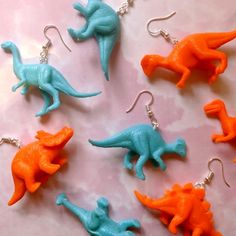 Get Jurassic with our block colour dinosaur earrings! We have a bunch of various options!You will receive a random pair of dinosaurs, the photos are examples of the pairs we sell. These earrings are great fun and super light! You are welcome to request specific dinosaurs, but we can't guarantee we will have them in stock. To keep them all clean and tidy you can give them a wipe down with a damp cloth.All of our hooks are silver-plated, but we also do 925 sterling silver hooks, clip-ons, and clas Fimo Ring, Weird Jewelry, Dinosaur Earrings, Quirky Earrings, Earrings Aesthetic, Indie Jewelry, Earrings Polymer, Block Colour, Funky Earrings