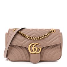 This is an authentic GUCCI Calfskin Matelasse Small GG Marmont Shoulder Bag in Porcelain Rose. This shoulder bag is crafted of smooth and supple calfskin leather in a beige pink. This bag features an aged gold chain shoulder strap with a leather shoulder pad. The crossover flap has a GG logo and opens to a beige microfiber interior with a zipper pocket. Porcelain Roses, Gg Logo, Gg Marmont, Gucci Bags, Gucci Bag, Shoulder Pads, Crossover, Gold Chain, Gold Chains