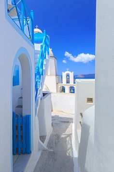 a white and blue building with stairs leading up to it