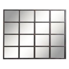 a mirror that is on the wall with many squares in it and one has been made out of metal