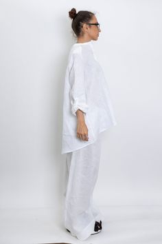 The White linen blouse women is our favorite weekender. Featuring an oversized relaxed fit with front button closing and long sleeves. The long sleeve shirt is made from lightweight linen, that is versatile for any occasion! The White linen blouse women is designed to be comfortable and not troublesome to wear. After wearing this White long sleeve linen shirt women, you will love it even more. ▸FABRIC The white linen blouse women is made from high quality 100% linen ▸SIZING This model linen shir Summer Cotton Blouse With Set-in Sleeves, Spring Long Sleeve Blouse With Set-in Sleeves, Casual Long Sleeve Tops With Set-in Sleeves, Casual Long Sleeve Blouse With Set-in Sleeves, Versatile Summer Tunic With Relaxed Fit, Oversized Spring Tunic For Loungewear, Oversized Spring Tunic Tops, Summer Loungewear Blouse With Button Cuffs, Oversized Tunic Tops For Spring