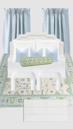 a white bed with blue and green pillows