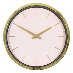 a white clock with gold hands on a white background