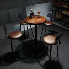 three stools and a table in a room