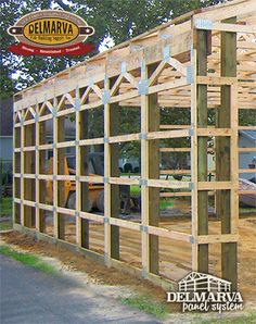 an image of a house being built with wood framing on the front and back sides