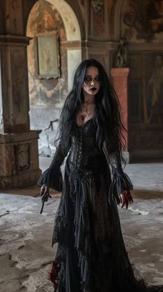 a woman dressed in black with long hair and blood on her face holding a knife