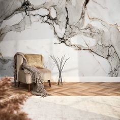 a chair sitting on top of a wooden floor in front of a wall covered in marble