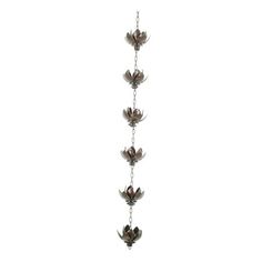 a long metal chain with flowers hanging from it