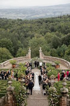 an outdoor ceremony in the middle of a garden