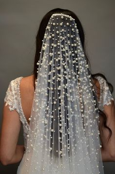 CAMILLE Cascades of Pearls Royal Cathedral Veil WHAT WE LOVE: Creamy pearls upon soft sheer bridal veiling elegantly cascading down from the top of the veil and ending in a delicate scatter... The Camille Royal Cathedral Wedding Veil is an utterly dreamy cathedral bridal veil that envelops you in breathtaking elegance with simple clean cut edging and dramatically scattered creamy faux pearls throughout the veil for a sleek and fashion forward look. DETAILS: Soft Bridal Tulle Available in Creamy Cathedral Length Wedding Veil, South Indian Wedding Hairstyles, Brides Made, Ivory Bridal Veil, Cathedral Wedding Veil, Cathedral Bridal Veils, Hairstyles Design, Cathedral Wedding Veils, Pearl Veil