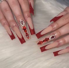 Bling Red Acrylic Nails, Royal Red Nails Acrylic, Nails Red Quince, Red And White Long Acrylic Nails, Red Acrylic Nails Coffin With Gems, Red French Tip Acrylic Nails Long, Cute Long Red Nails, Red Long Nails Ideas, Red French Tip Nails Bling