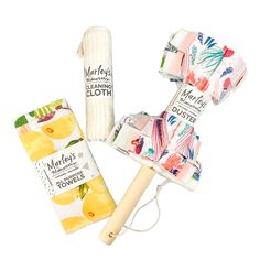 three different types of cloths and a wooden mallet on a white background with clippings